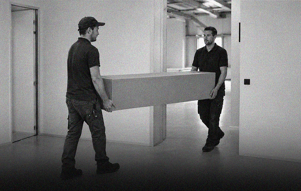 CONERGIES personnel handling a packaged paint protection film roll